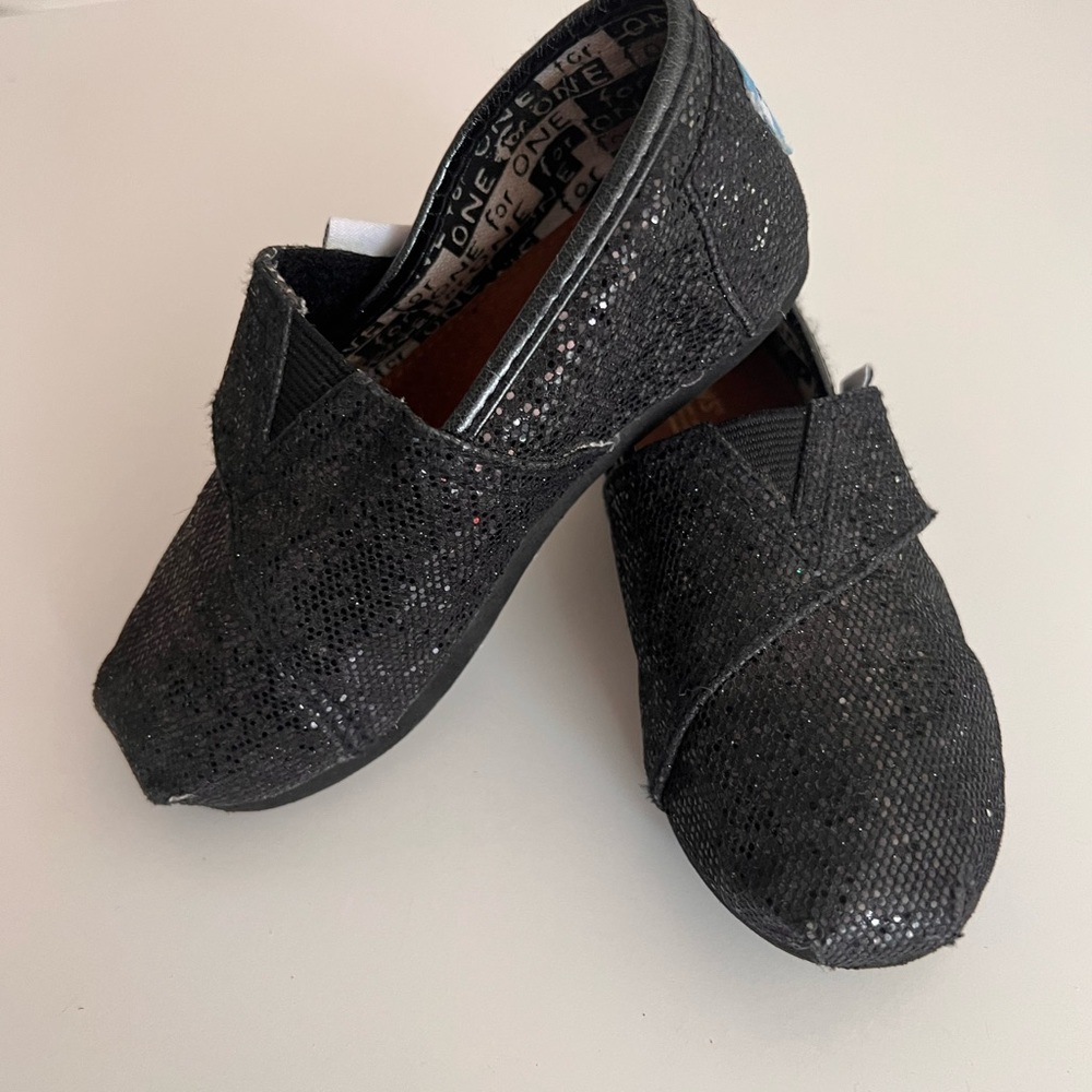 Tom’s black sparkle